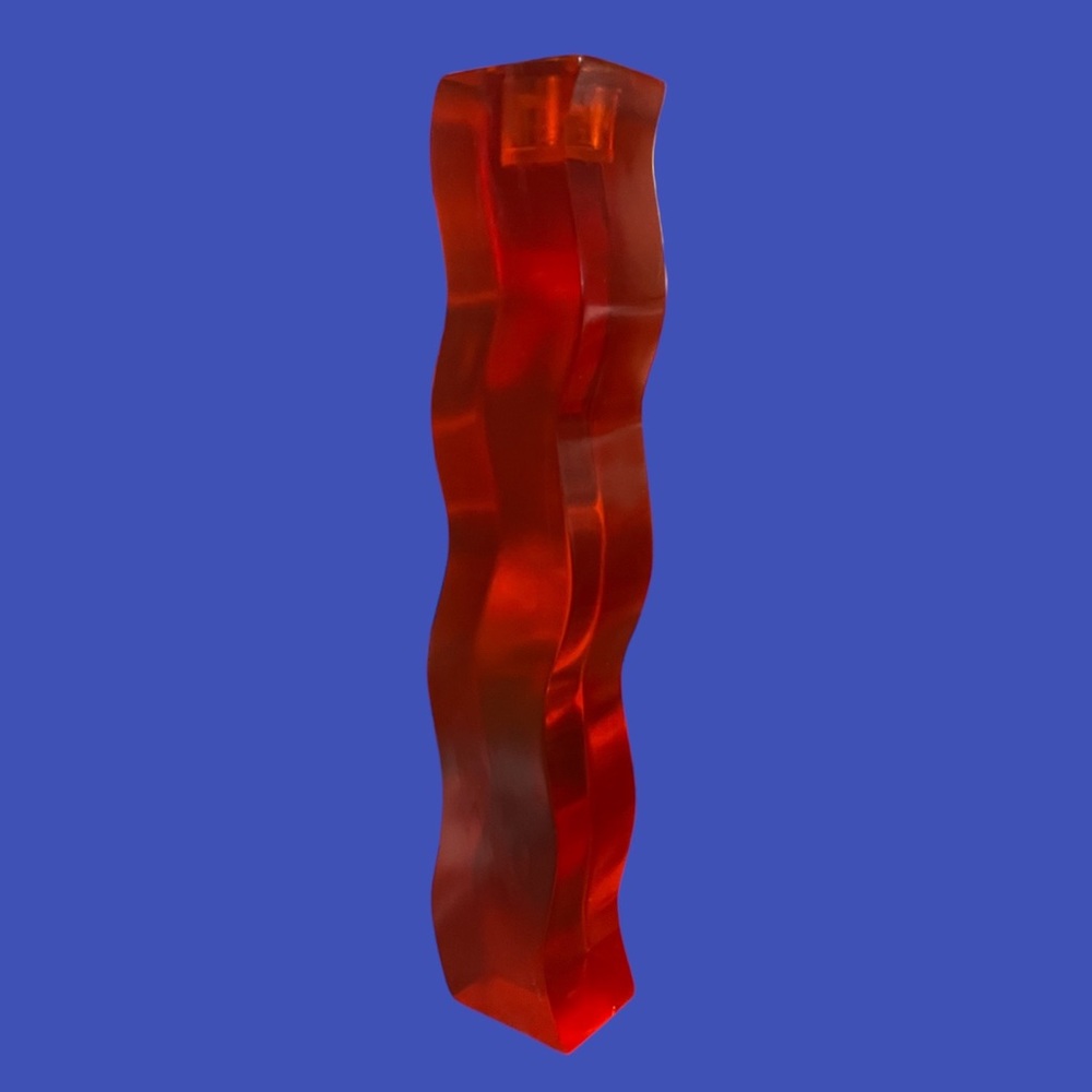 Possibly lucite wavy candle holder
